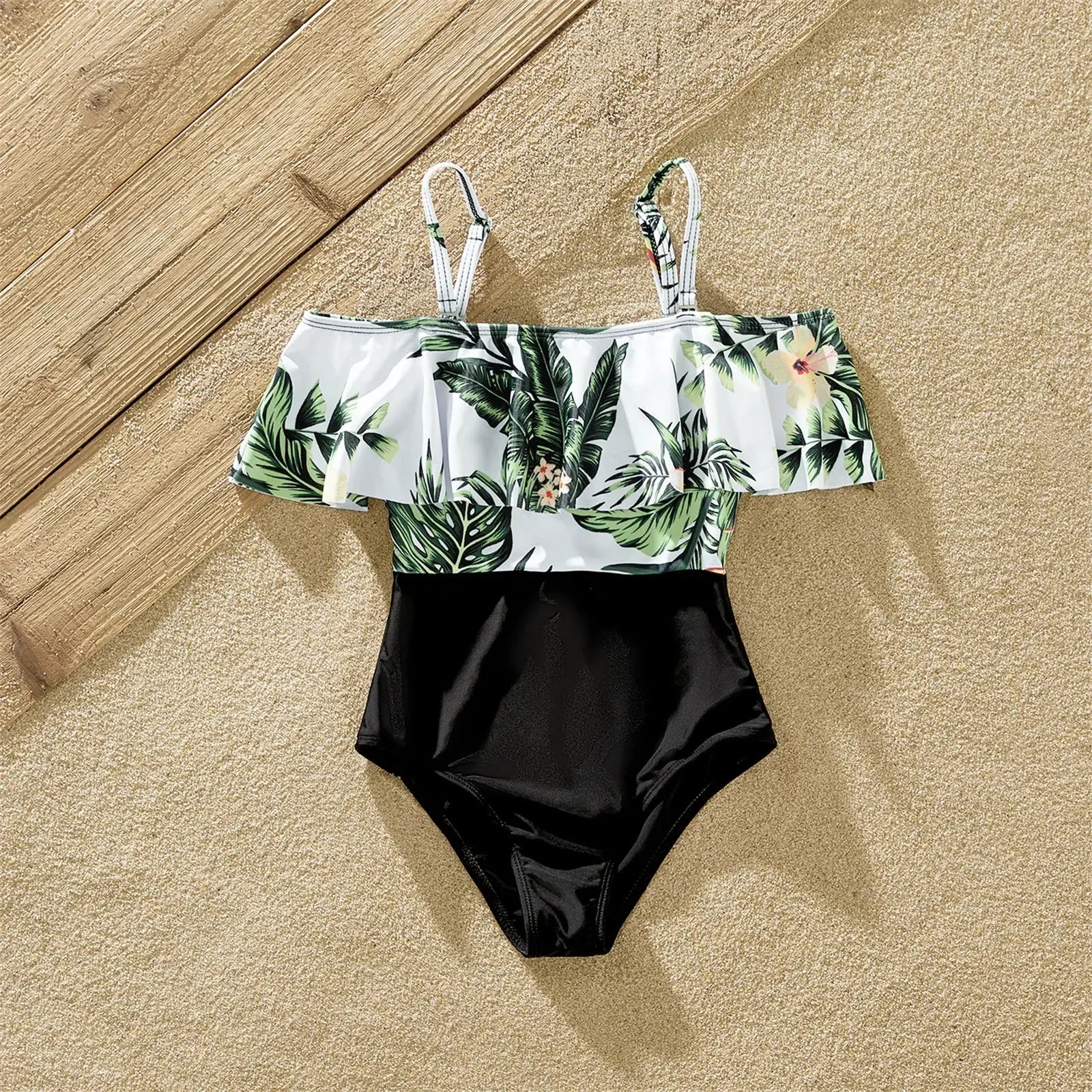 Detail of ruffle strap design on a women's plant print swimsuit, stylish polyester spandex beachwear