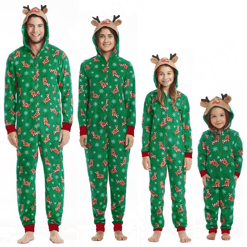 Family relaxing in matching parent-child reindeer jumpsuit pajamas, festive winter cozy sleepwear