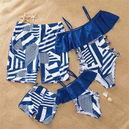 Family matching ruffled one-piece swimsuits in blue, perfect for summer beach fun