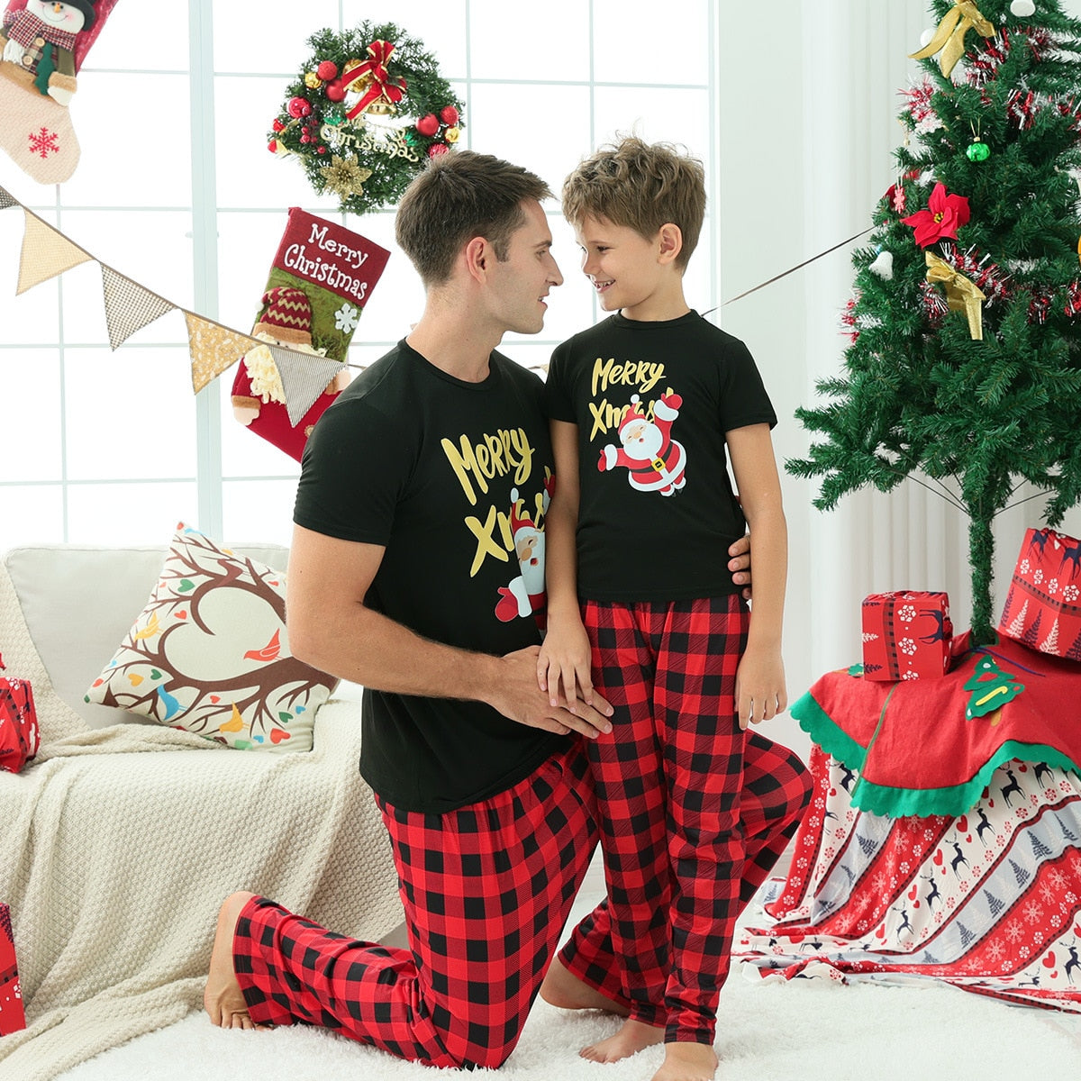 Matching family pajama set featuring short sleeve tops and long pants in a vibrant pattern, perfect for home