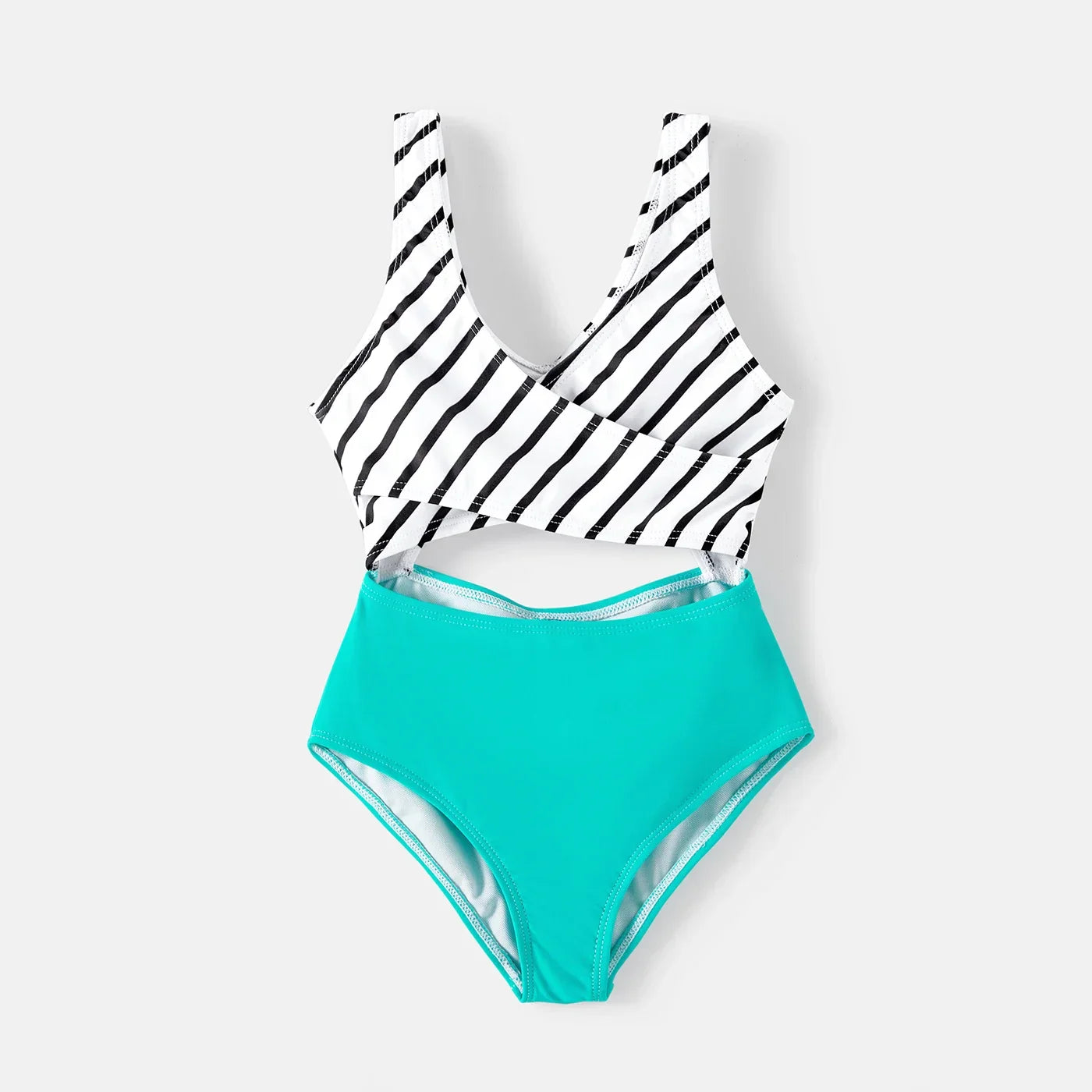 Parents and child wearing matching striped swim apparel, ideal for poolside fashion