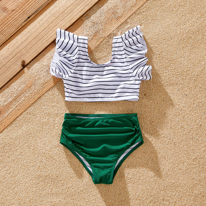 Mom's green striped one-piece swimsuit, perfect for family poolside fashion