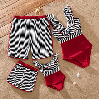 Family matching striped swimwear set for beach vacation, blue and white stripes, poolside fashion.