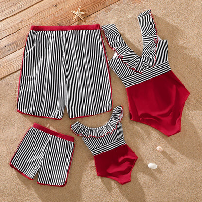 Matching family striped swimwear, a cohesive look for poolside fun and beach days.