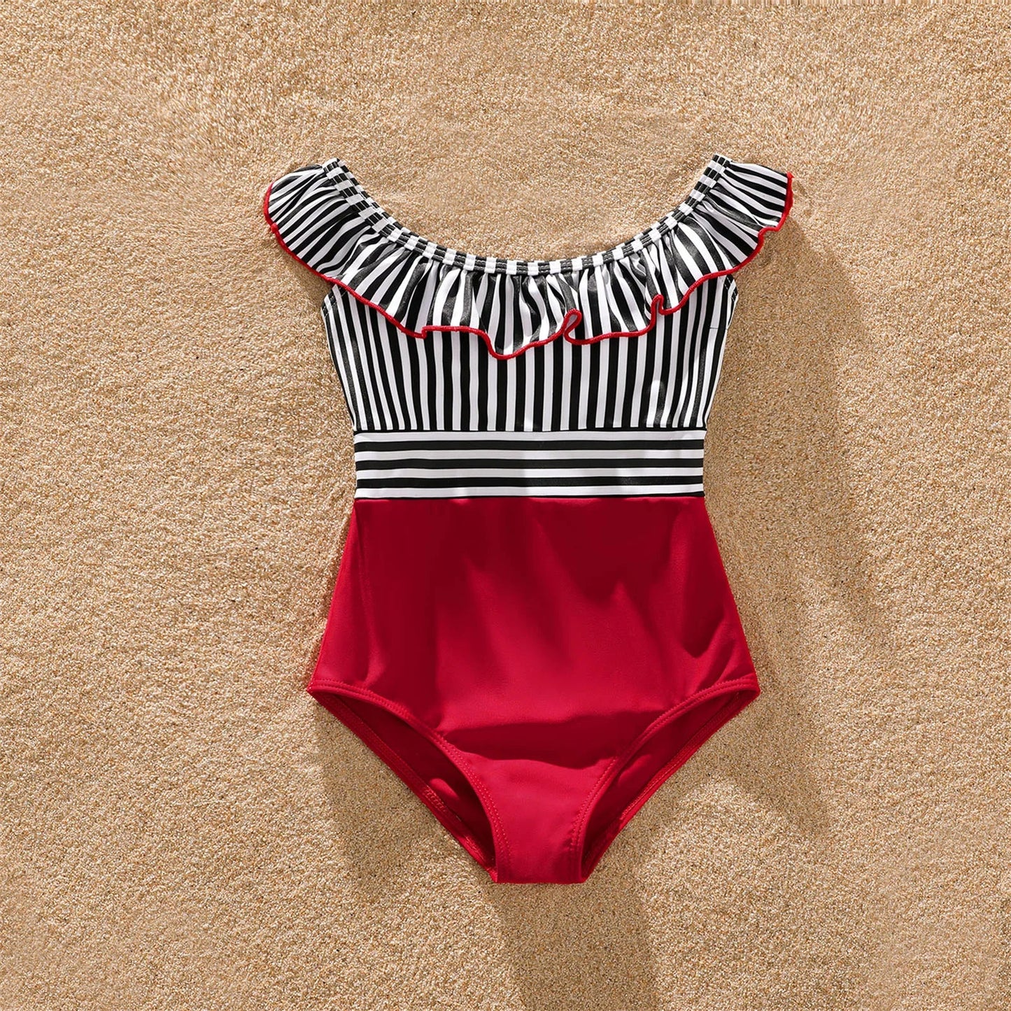 Striped one-piece women's swimsuit and men's trunks, part of family matching swimwear.