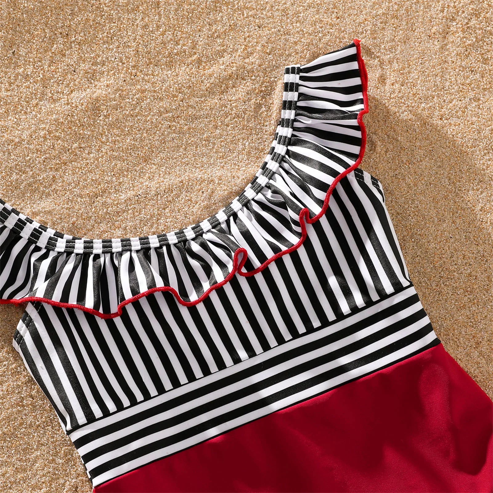 Kids' striped swim shorts and top, matching family swimwear for summer outings.