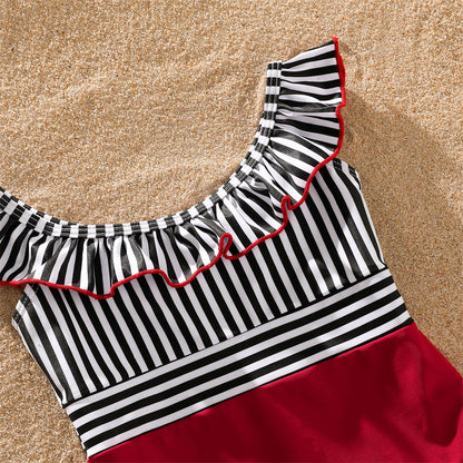 Kids' striped swim shorts and top, matching family swimwear for summer outings.