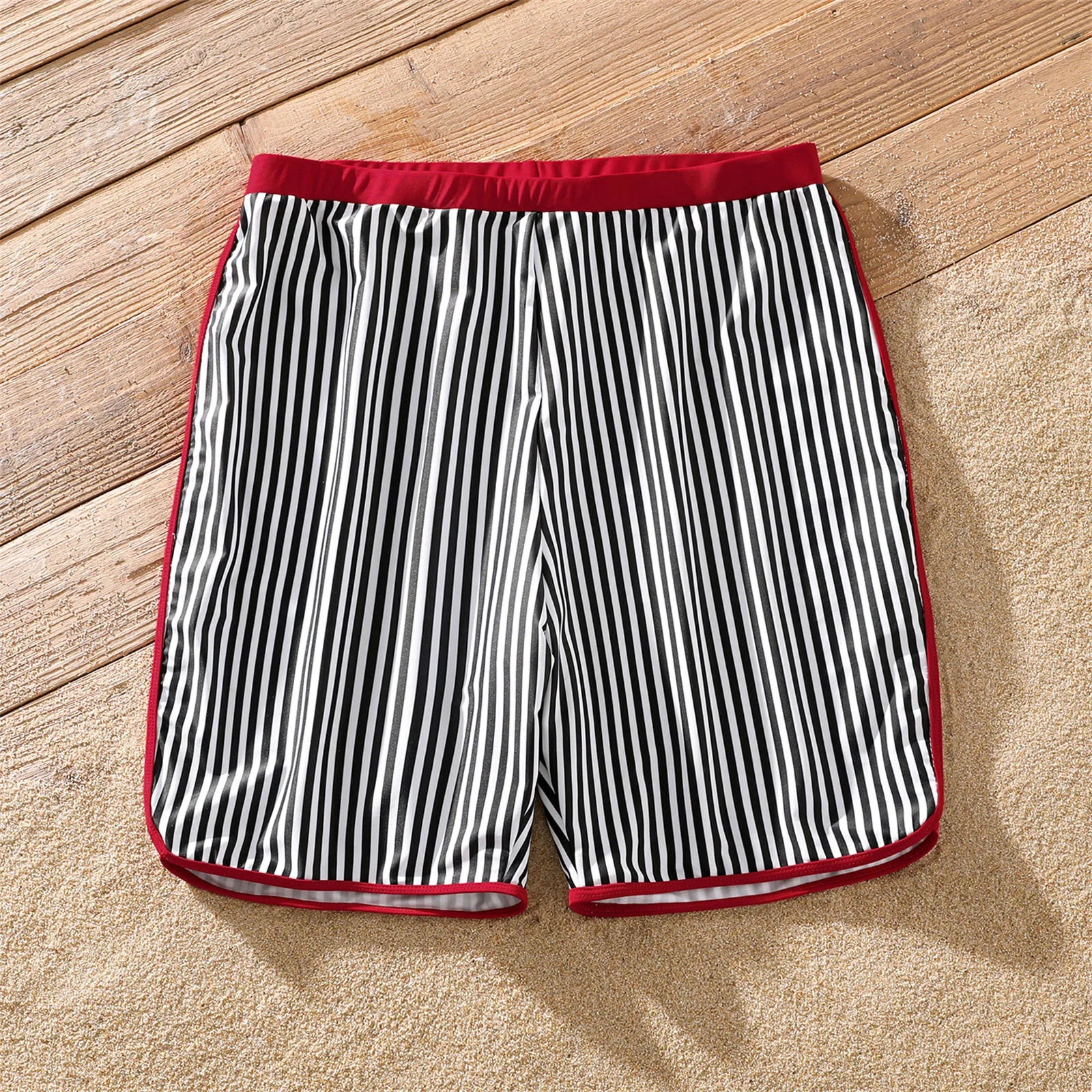 Collection of striped family swimwear, men's, women's, and children's styles displayed.