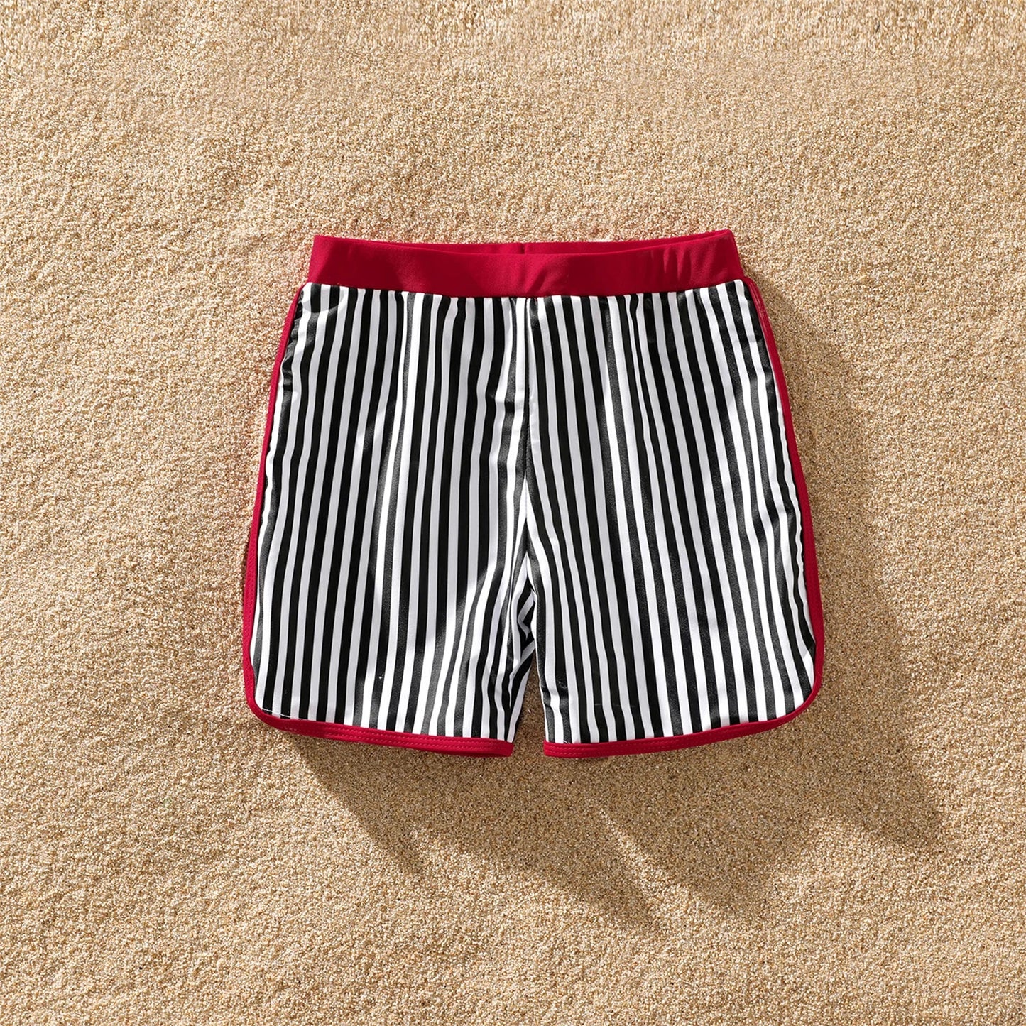 Matching blue and white striped swimwear for family, ideal summer vacation essentials.