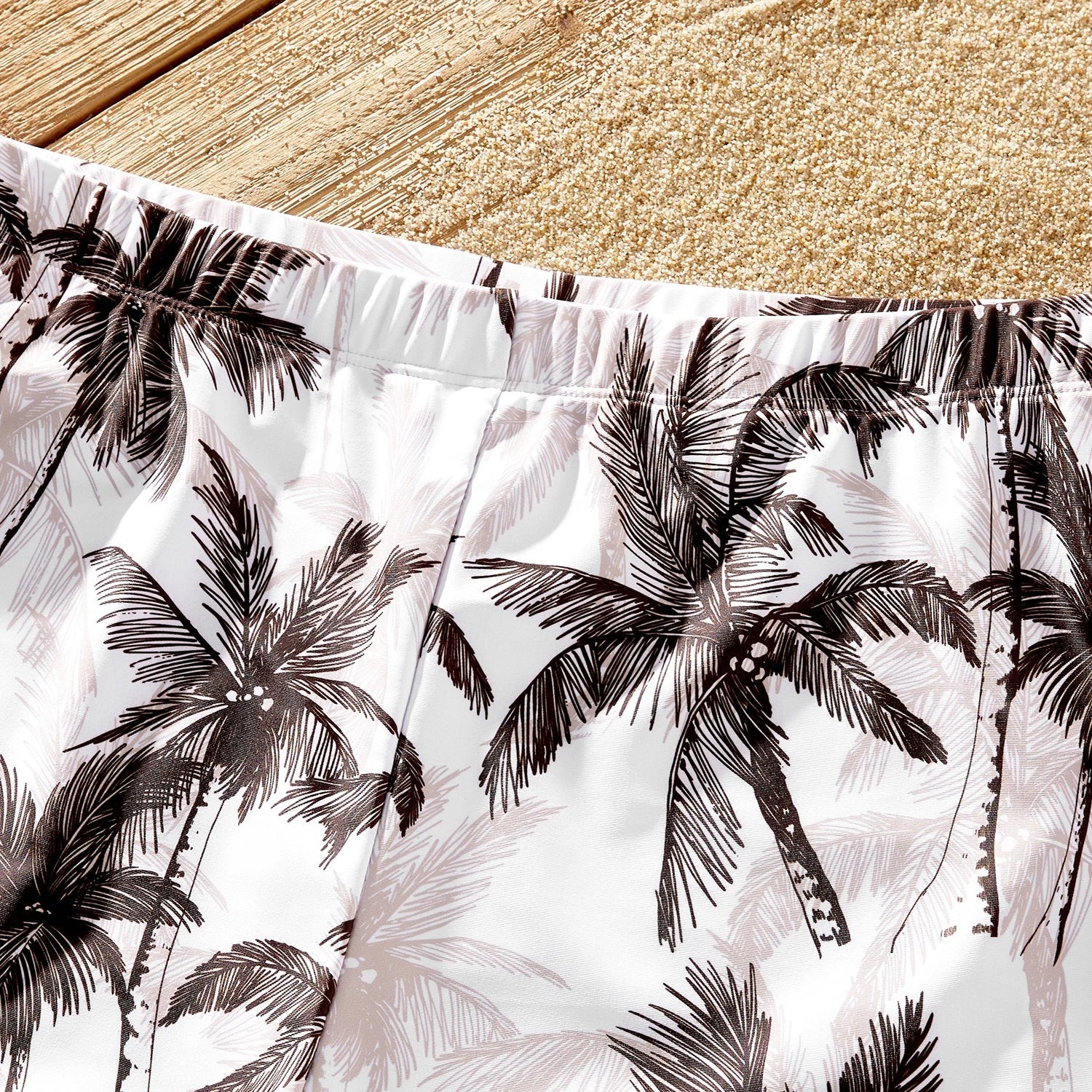 Matching family swimsuits showcasing the unique coconut tree and khaki tropical design