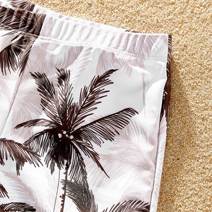 Parents and children in coordinated coconut tree print swimsuits, enjoying summer vacation