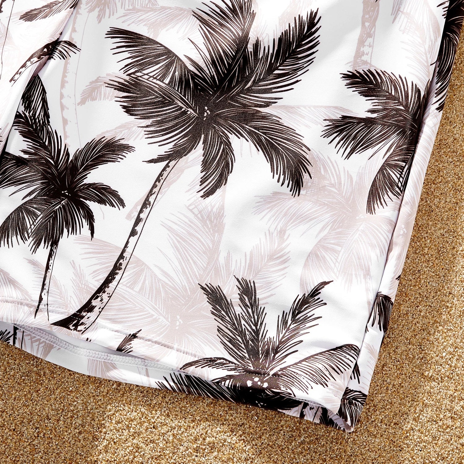 Stylish coconut tree print matching swimsuits for the whole family; khaki and tropical design