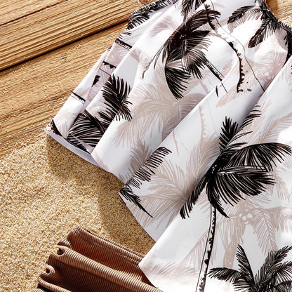 Khaki family matching swimsuits with bold coconut tree print; perfect tropical summer beachwear