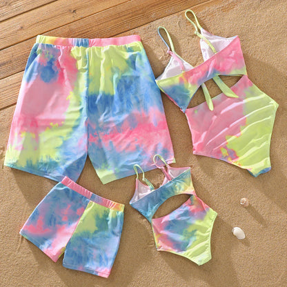 Mother and daughter in colorful tie-dye V-neck one-piece swimsuits