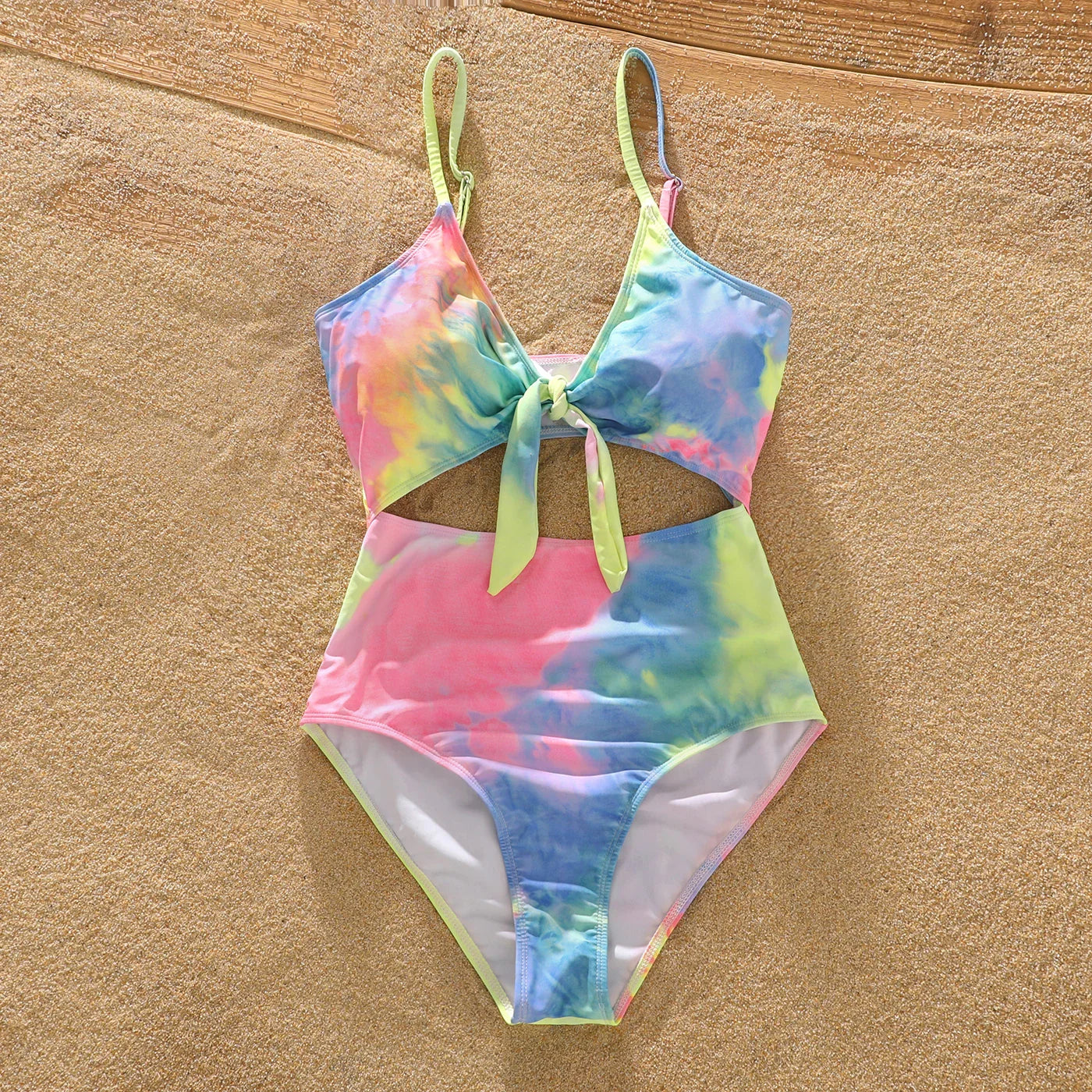 Father and son wearing tie-dye swim trunks, perfect for family beach day