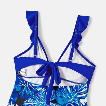 Women's tropical leaf print ruffle one-piece swimsuit, V-neck, comfortable and chic pool attire.