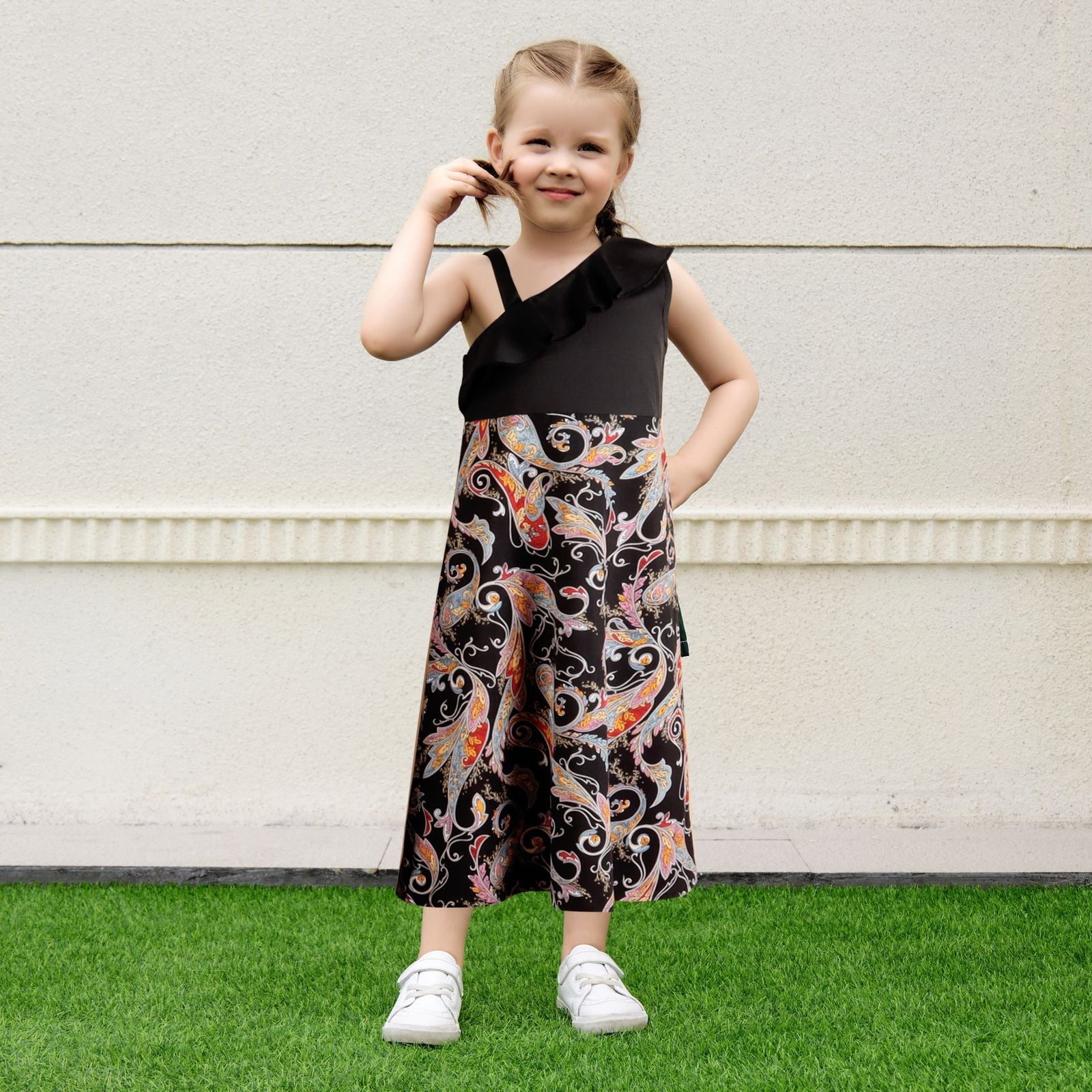 Elegant family of three in modern black textured matching outfits, perfect for any vacation.