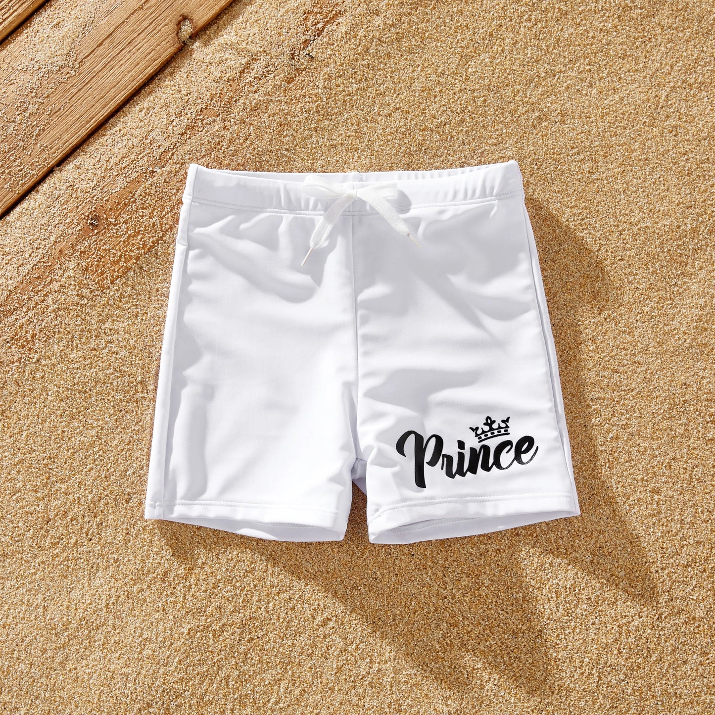 Summer vacation family matching white letter print swimwear for beach or resort.