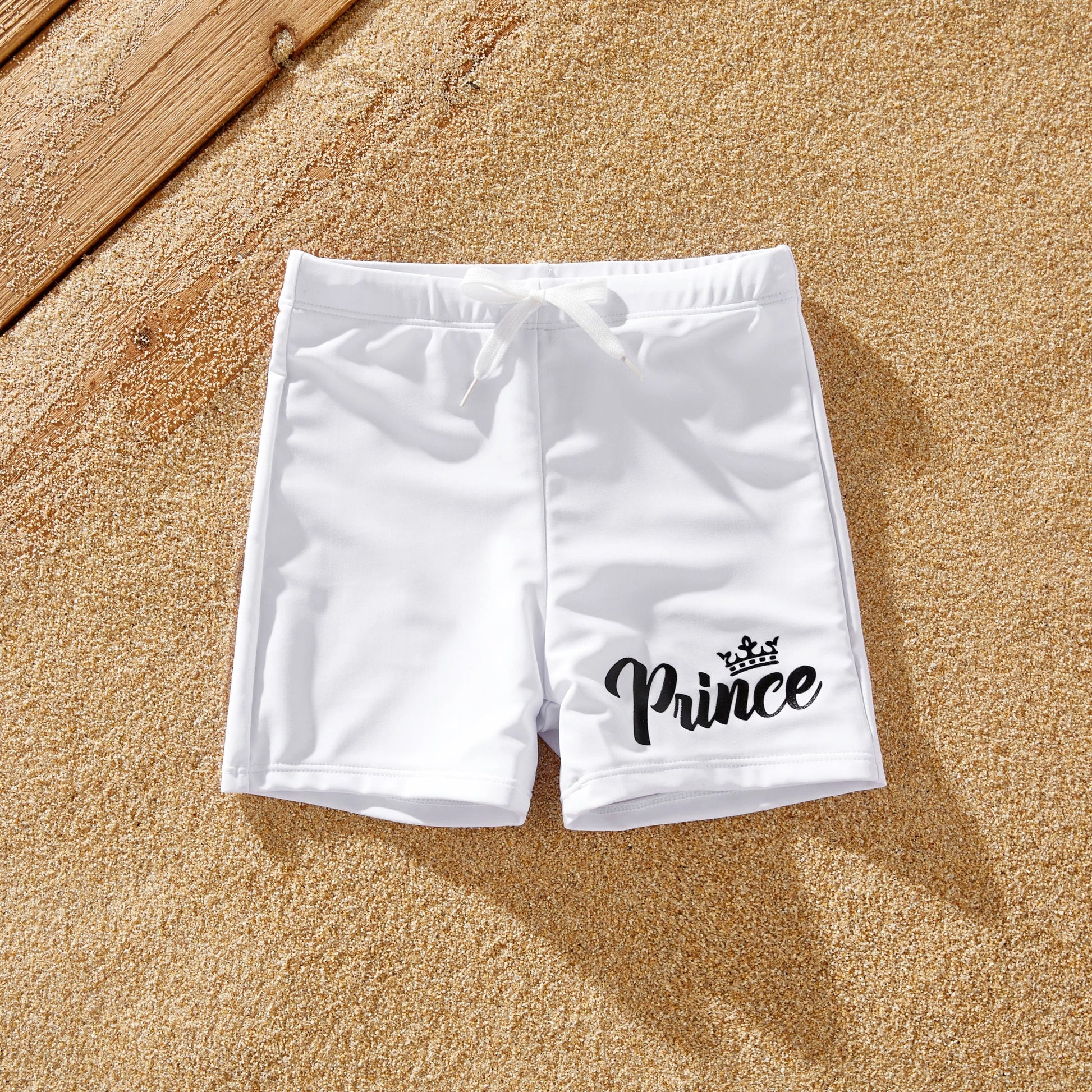 Summer vacation family matching white letter print swimwear for beach or resort.