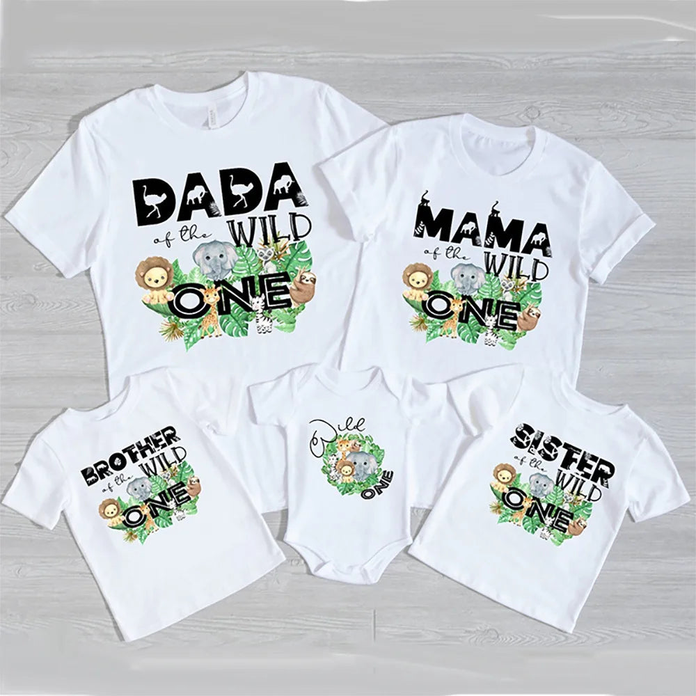 Adult, kid, and baby 'Wild One' jungle theme matching outfits for a fun family party