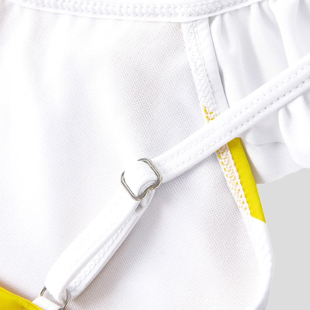 Dad and son in matching yellow striped swim trunks, ideal for family vacation beachwear, quick-dry fabric.