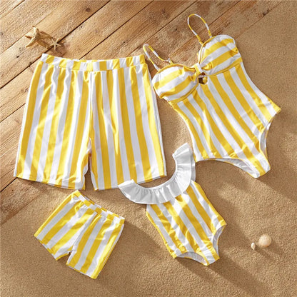 Close-up of vibrant yellow striped family matching swimsuits fabric, chinlon spandex for comfortable fit.