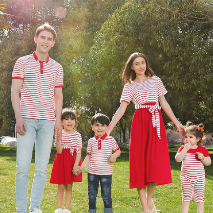 Family striped outfits: mom, dad, and child smiling, wearing blue and white striped casual clothes.