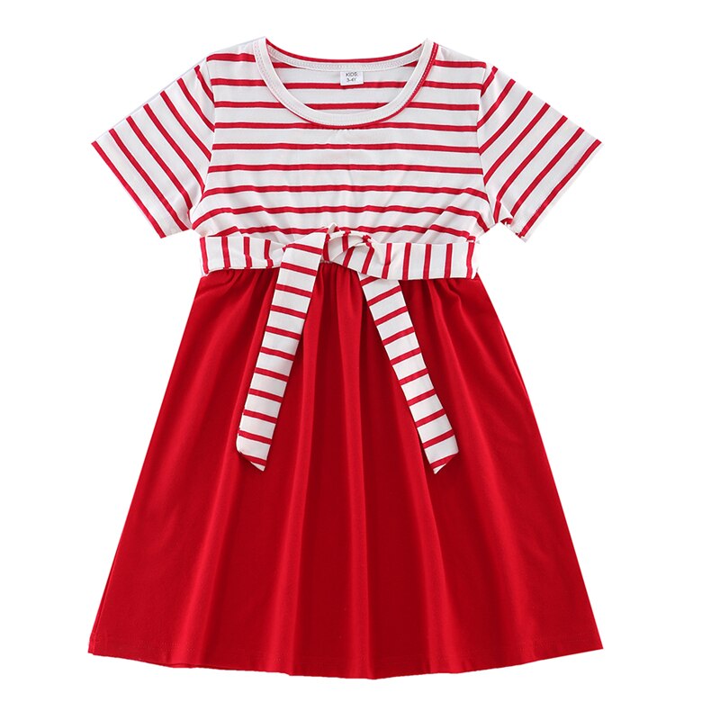 Three-piece family look: parents and toddler in coordinated striped shirts for family fashion.