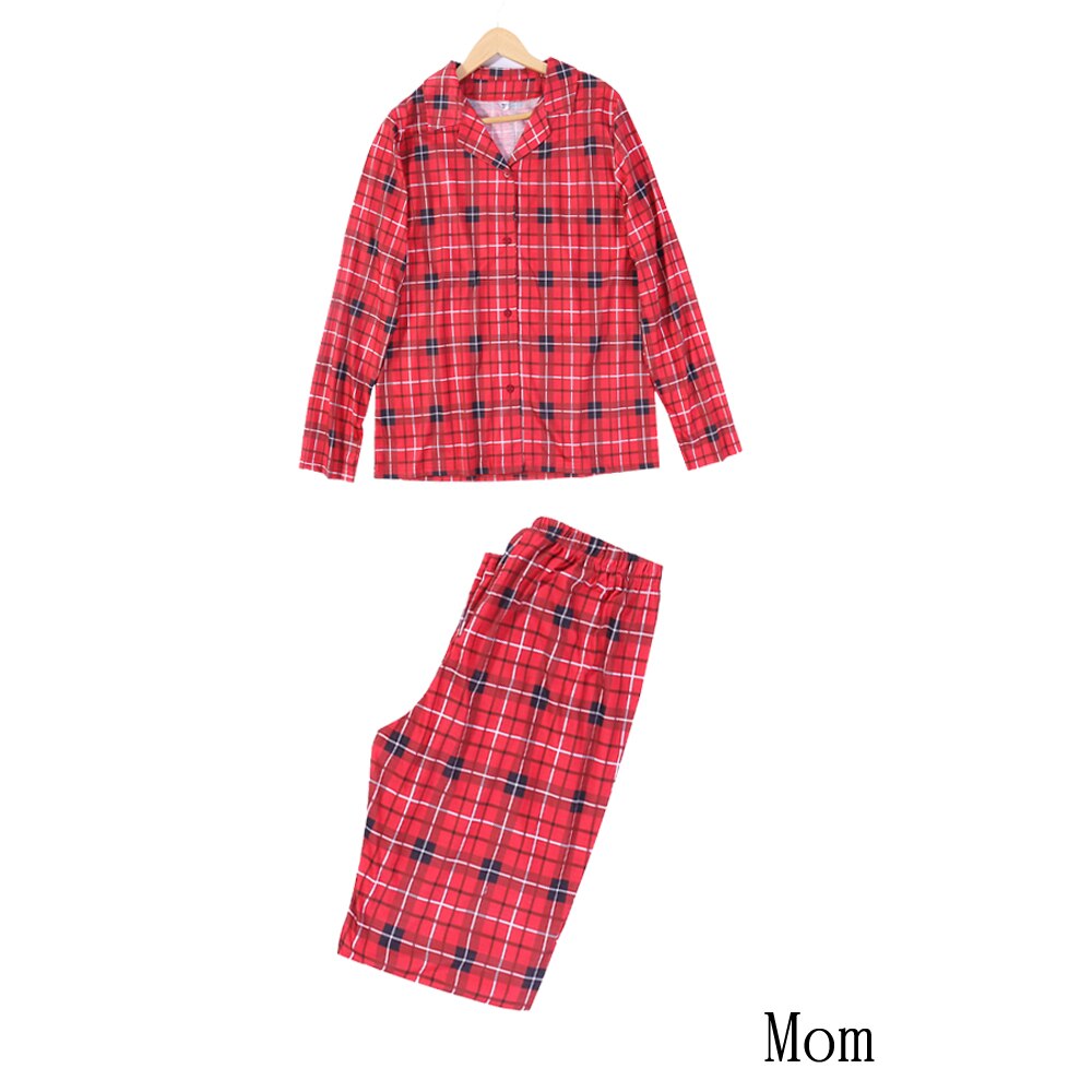 Adult man and woman in cozy full-sleeve plaid pajamas, matching sleepwear for the whole family.