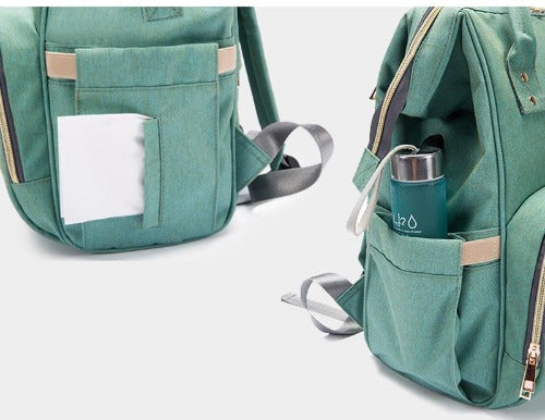 Close-up of USB charging port on Fit-All Unisex Diaper Backpack, black cable visible