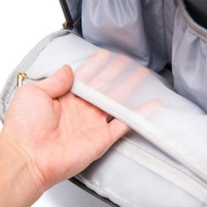 Maternity backpack worn by a parent, showing comfortable shoulder straps and spacious design