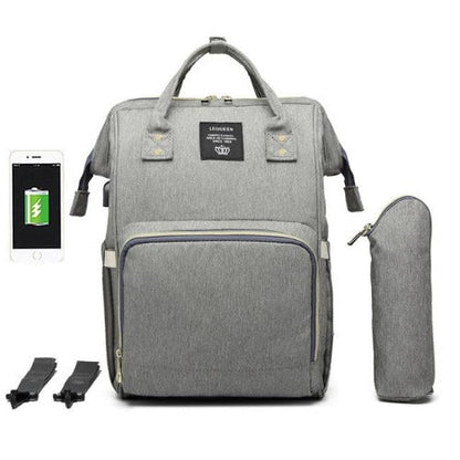 Fit-All unisex baby bag filled with baby essentials: bottles, wipes, and toys