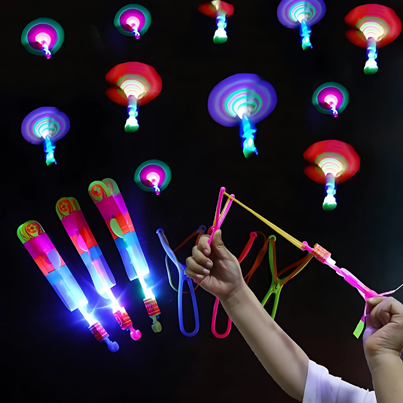 Five LED glow-in-the-dark slingshot flyer toys in various colors, perfect for kids' night outdoor play.