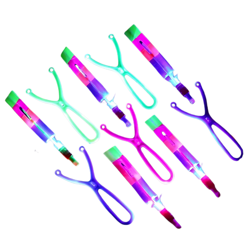 Assortment of vibrant LED glow-in-the-dark slingshot flyers on a dark background, ready for kids' night activities.