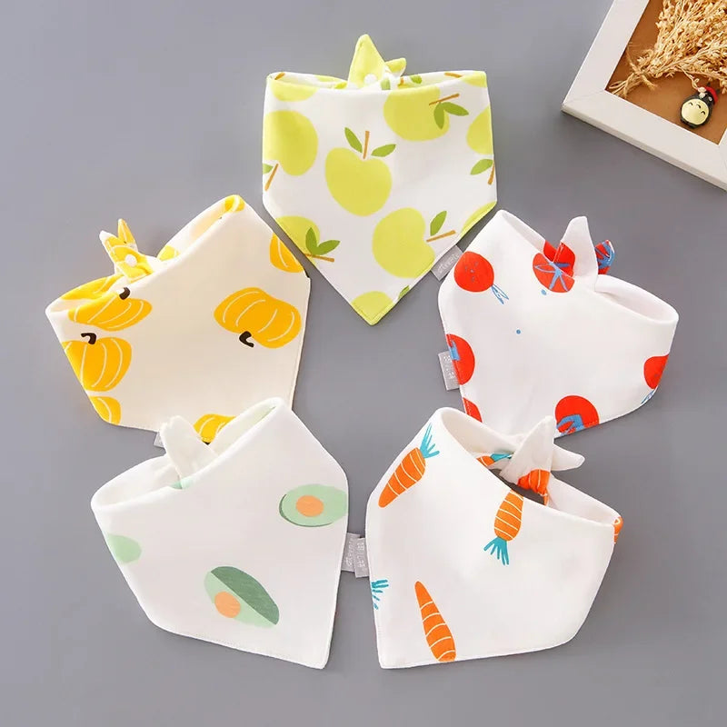 Stack of five different cartoon cotton baby bibs, a great baby shower gift idea