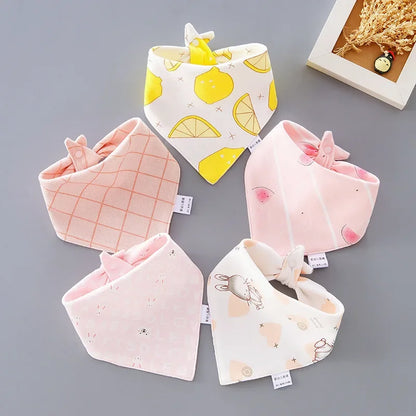 Newborn essentials: a 5-pack of soft cartoon cotton bibs, ideal for daily use and feeding