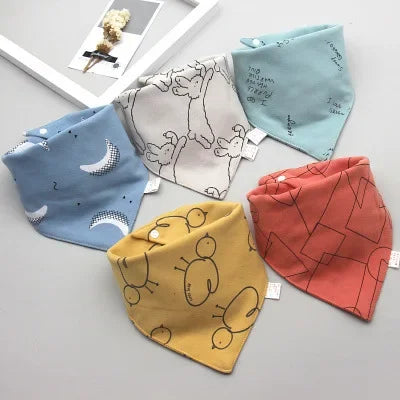 Detailed view of cotton fabric on a baby bib, highlighting its softness and absorbency