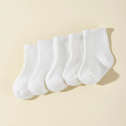 Pack of five pairs of durable, breathable cotton baby socks for everyday infant clothing.