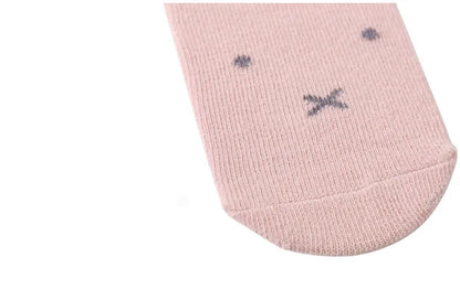 Close-up shot of the soft cotton fabric and detailed cartoon on a baby anti-slip sock