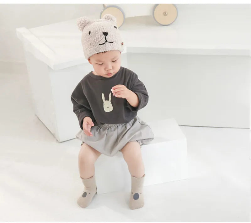 Toddler anti-slip socks with cartoon designs, providing safety during early walking