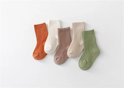 Group of five pairs of high-quality cotton blend kids socks, durable and comfortable.