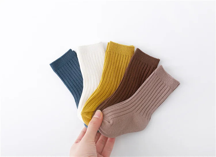 Five pack of breathable cotton blend socks for babies and toddlers, in playful colors.