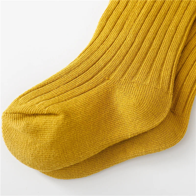 Detailed shot of a single cotton blend children's sock, highlighting its soft knit.