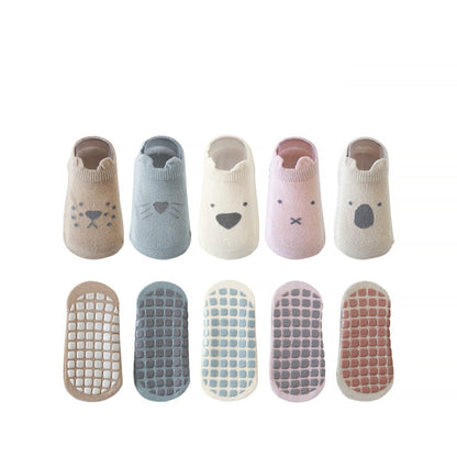 Children's non-skid ankle socks, multi-colored and slip-resistant for safe play.