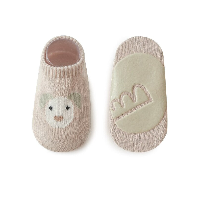 Top-down view of a pair of yellow non-skid ankle socks, ideal for active young children.