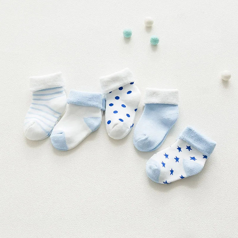 Five pairs of unisex baby cotton cartoon thick socks in assorted colors for newborns.