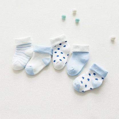 Five pairs of unisex baby cotton cartoon thick socks in assorted colors for newborns.