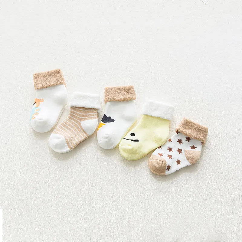 Isolated image of a single blue unisex baby cotton cartoon thick sock, gentle for infants.