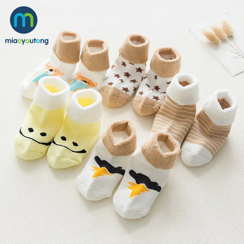Set of five vivid cartoon-themed thick cotton socks suitable for unisex baby comfort.