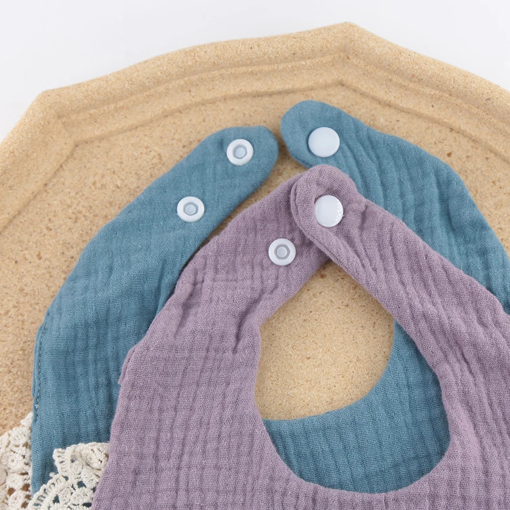 Practical 5-pack of cotton bamboo baby bibs, offering protection during feeding and teething.